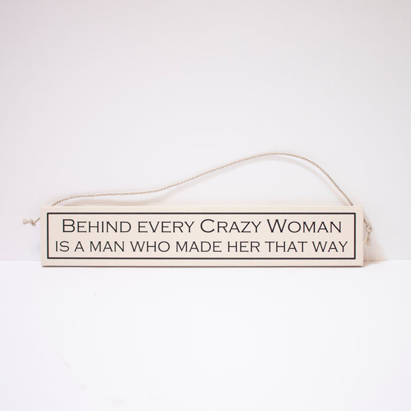 "Behind Every Crazy Women Is A Man Who Made Her That Way" Sign